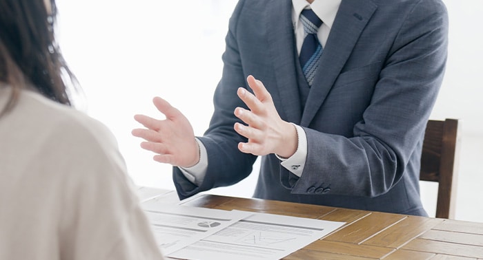 Business meeting with documents on table